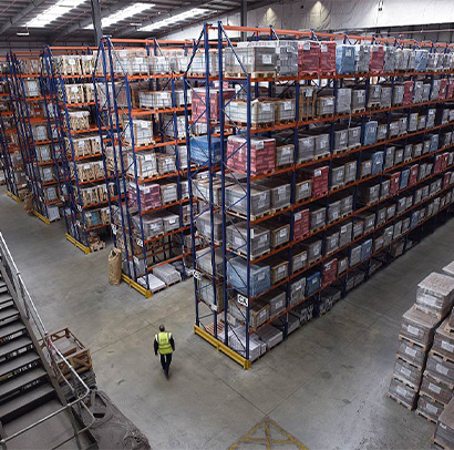 Inside a warehouse with high racking filled with stock